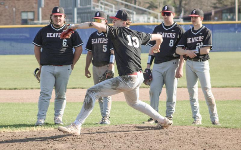 The Beaverton infield lines up to encourage relief pitcher Ian Roberts as he warms up to get the last out of the first game of last Tuesday’s doubleheader sweep at Gladwin.