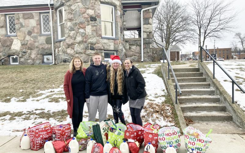 Helping pass out the food curbside were Owner Sheryl Sacry, Team Member Kooper Brewer, Kortni; and Chef Monica Antes.