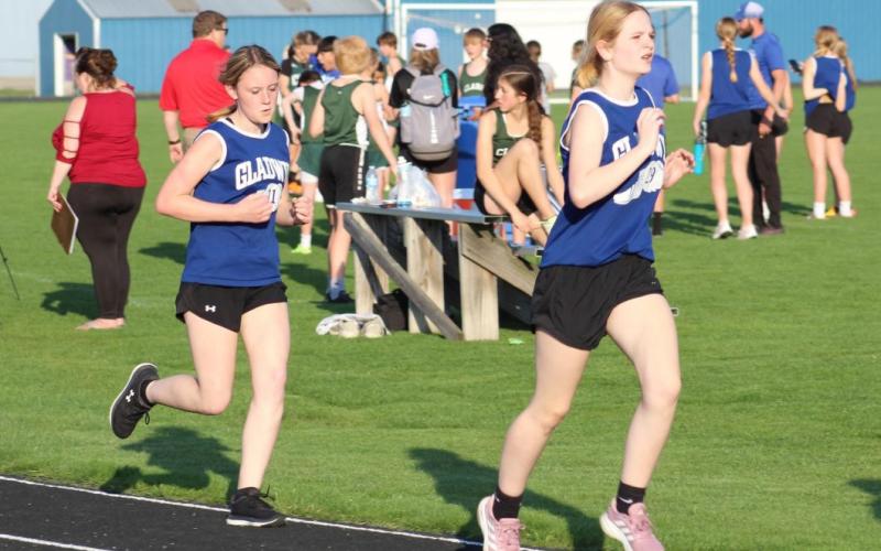 Gladwin runners, Arabella MacInnes and Ella Sorenson, are determined to finish strong. PHOTO PROVIDED BY MELISSA ROBINSON
