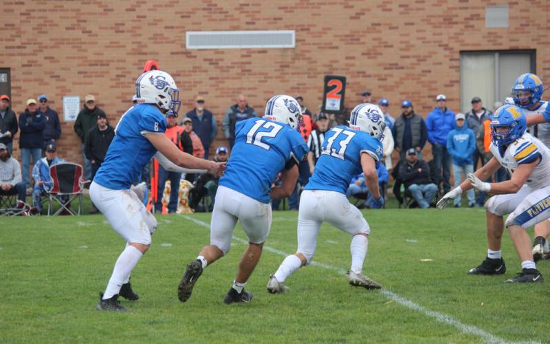 Earl Esiline leads the way, blocking for Logan Kokotovich as he takes the handoff from QB Nick Wheeler.