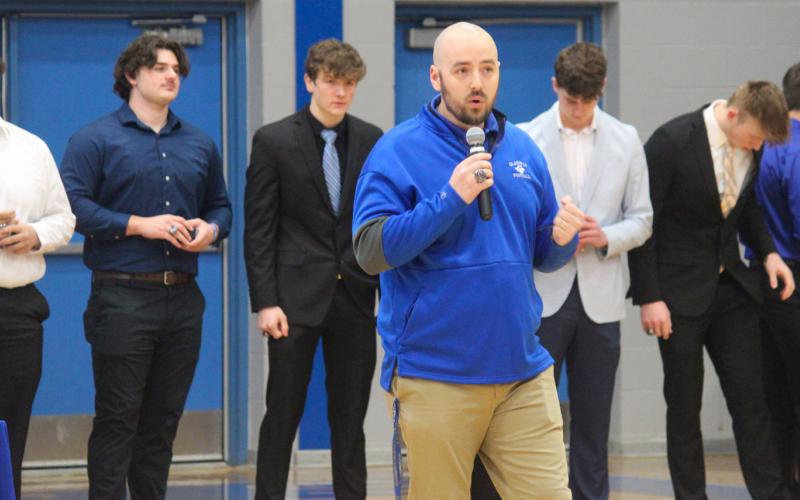 Coach Marc Jarstfer gives inspiring speech during the ring ceremony for the Gladwin Flying G’s 2022 varsity football team, praising two communities coming together as one for something special.
