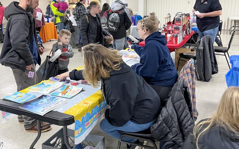 The children’s model fire truck (inset photo) sits among various emergency kits as the grand prize at the Winter Carnival event on Feb. 25.