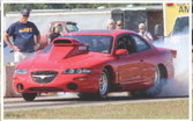 Thunder on the Strip took place on September 9 at the Zettel Memorial Airport. Check out more photos on our Facebook page. Inset photo, racer warming up his tires during staging.