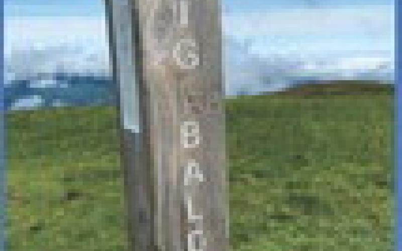 McLaughlin is pictured hiking through the Roan Highlands near Roan Mountain, Tennessee. Inset photo, elevation marker at Big Bald Mountain with an elevation of 5516 feet. PHOTO BY JOHN DEL PERCIO