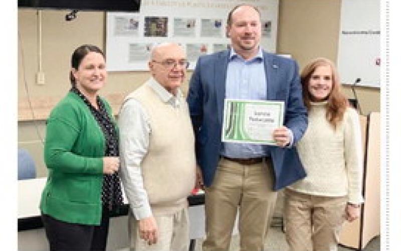 Graduate Lance Tenwalde poses with his certificate with (left to right) Karrie Hulme, Joel Vernier and Karen Moore, of the Gladwin County Leadership Program.
