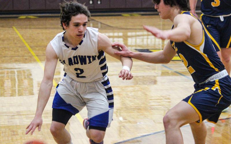 Brady Gehrett works his way around a Standish-Sterling defender.