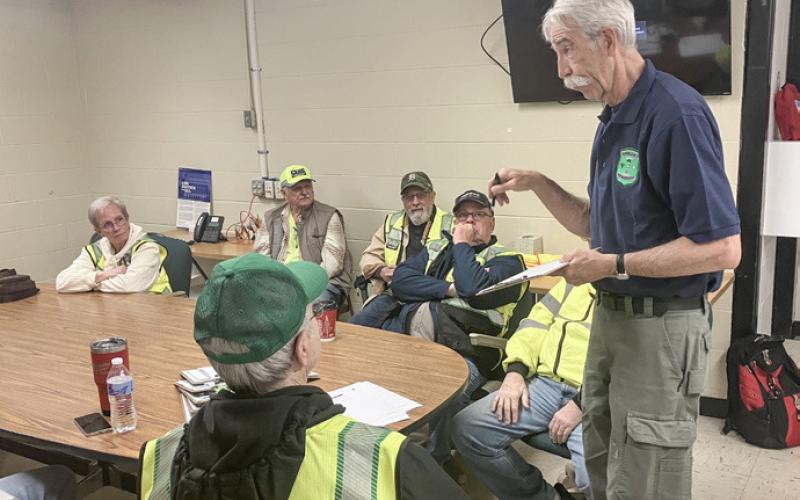 Gladwin County Emergency Management Director Bob North passes out instructions to Community Emergency Response Team volunteers prior to a training exercise that was held Saturday.