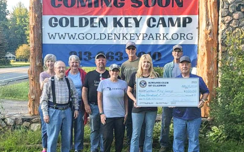 Pictured in front row: Duane Miller, Kiwanis; Karen Moore, Kiwanis and Rotary; Lisa Kujawa, Golden Key Camp Founder; Dave Crawford, Kiwanis President, presenting $500 check. Back row: Lori Johnson, Kiwanis; Diana Miller, Kiwanis; Mike Moore, Kiwanis spouse; Al Sawaya, Rotary; and Dave Petherbridge.