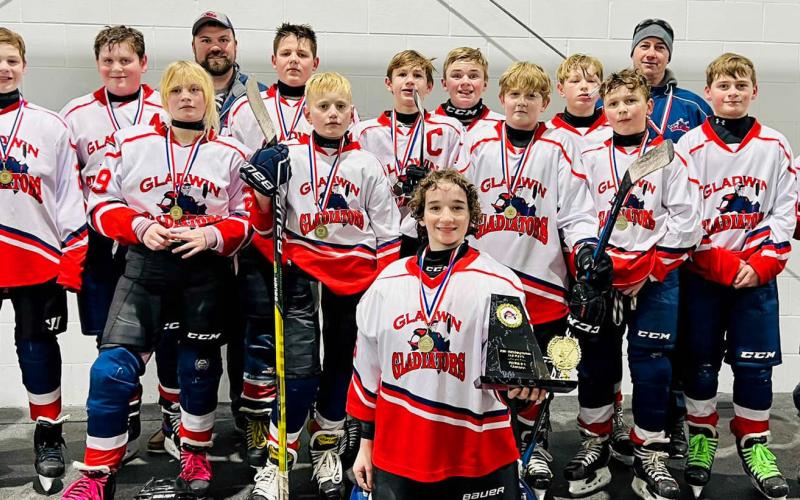 Pictured in back row: assistant coach, Jim Oard; Landon Jenkins, Cameron Oard, assistant coach, Ryan Harris; Trinity Hair, Parker Woods, Korbin Harris, Caden McKeever, head coach, Devin Woods; middle row: Addison Anderson, Noah Bruursema, Hunter Eagan, Noah Scott, Preston Newman, Adalynn Lechner; front row: Calvin Knoerr (Goalie).