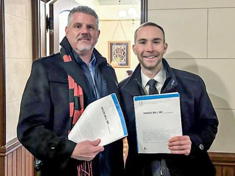 State Reps. Bill G. Schuette (right) and Mike Hoadley introduce House Bills 5419-20 at the state Capitol in Lansing on Wednesday, Jan. 31.