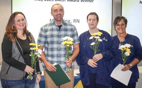 Nick King, R.N., MyMichigan Medical Center Gladwin, center, was one of 12 nurses across the MyMichigan Health system recently honored with The DAISY Award for Extraordinary Nurses. He stands with, pictured left to right: Ashley Scharf, R.N., Stacie Kellogg, R.N., Sharon McCauley, R.N., and Andrea Beecher, R.N.