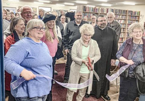 A ribbon cutting ceremony was held last Wednesday to celebrate the expansion of Sacred Heart Mission. Wielding the scissors is Florence DeShano, flanked by Director of the Mission Yvette Keast, Father Marcel Portelli and Chairman of the Board Pam Weaver.