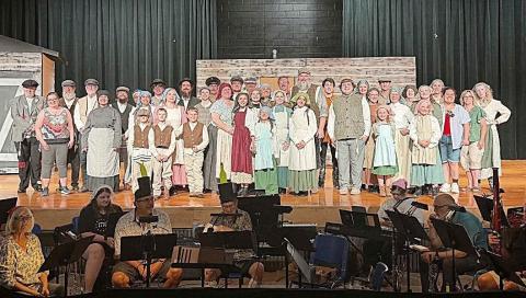 Cast and crew of Fiddler On The Roof with the orchestra on a rehearsal night.