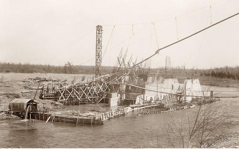 Pictured is Edenville Dam construction in 1924. Upon completion, it would retain a summer-time pond at 675.8 feet, creating Wixom Lake in the river valley of the Tittabawassee and Tobacco rivers. The dam held for 95 years – the failure was of the embankment that catastrophically collapsed on May 19, 2020.