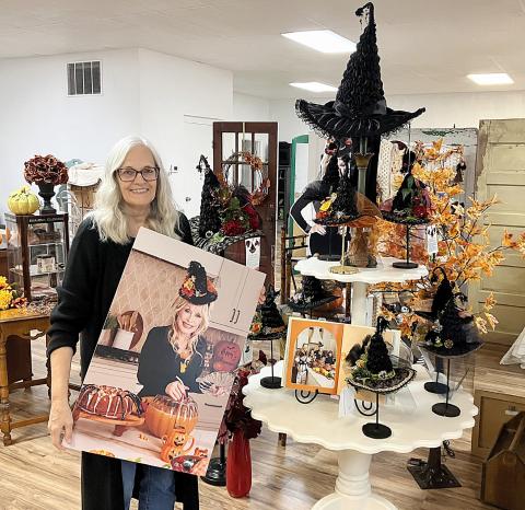 Gladwin’s Karen Steinkraus made the witch hat worn by the late Dolly Parton in a picture that appeared in the star’s latest cookbook and a copy is on display at The Golden Tree on East Maple.