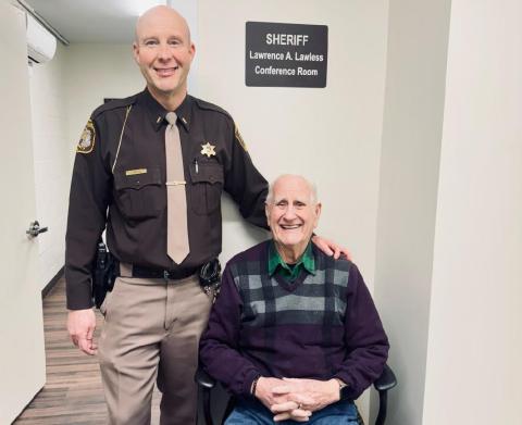 Lt. Troy Rabidue poses with his grandfather, former Sheriff Larry Lawless in Lawless’ former home.