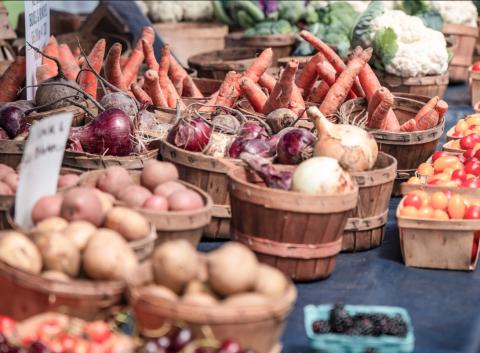 Baskets of vegetables rest on a table at a farmers market display at the Capitol in Lansing. DEPARTMENT OF AGRICULTURE AND RURAL
