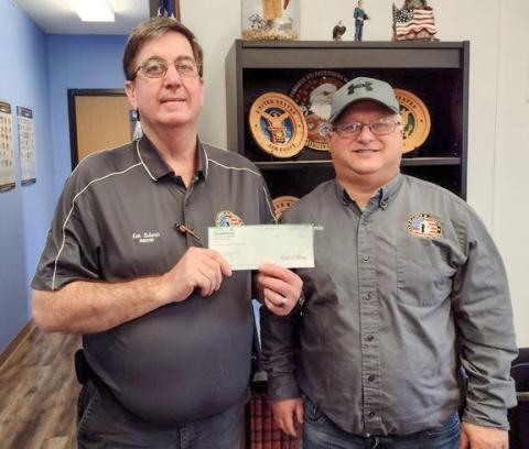 The Michigan Masonic Charitable Foundation presented with a donation to the Gladwin County Veterans Relief Fund aiding veterans and their families to help provide heating, electricity, and food. Pictured are Ken Roberts, Gladwin County Veterans Affairs Director (left) and Jamie McCoy, Veteran Service Officer (right).