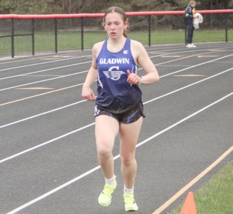 Gladwin’s Vivian Callaghan runs to a win in the 1600 meters during last Wednesday’s Jack Pine Conference event at Beaverton.