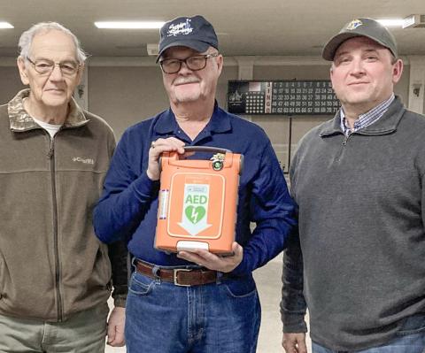 Pictured from left to right are Knights of Columbus (KofC) Grand Knight David Cooper, David Poxon, and Matt Fruchey. David Poxon generously funded the purchase of a new portable defibrillator for the Knights of Columbus as a memorial to his deceased wife, Janet Poxon. Matt Fruchey, an Emergency Medical Technician working for MyMichigan, demonstrated the unit to 20 Knights of Columbus members. “Thanks to David Poxon and Matt Fruchey for making us safer,” said Cooper.