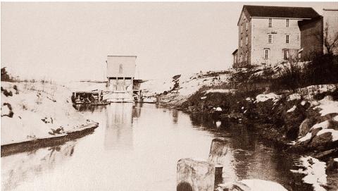 Gladwin Flour Mill and dam on the Cedar River. FROM A MONOCHROME PHOTO OF AN ORIGINAL IMAGE TAKEN BY JOHN RHODE CIRCA 1990