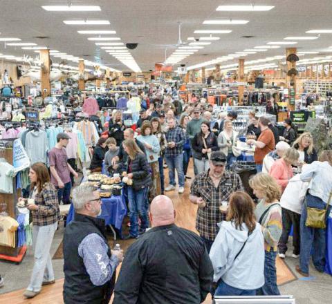 Crowd of people inside Jays Sporting Goods for A Northern Tradition event.