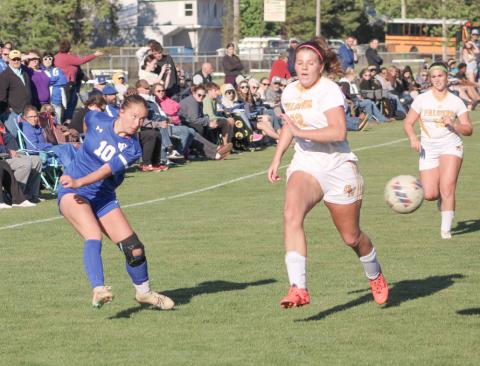 Gladwin’s Madisyn Lockwood fires a shot toward the Ogemaw Heights net during last week’s district tourney loss to the Falcons.