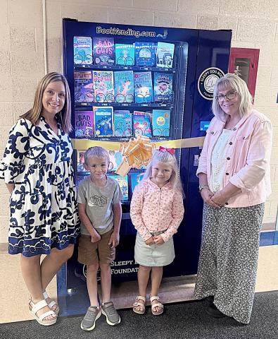 Gladwin Elementary School receives new book vending machine thanks to Sleepy Dog Foundation