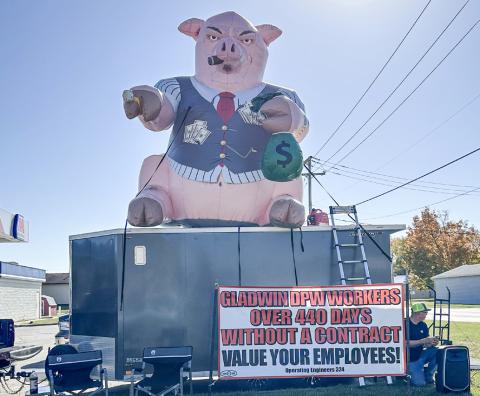 Gladwin DPW employees demonstrating October 21 at the corner of Cedar Avenue and State Street.