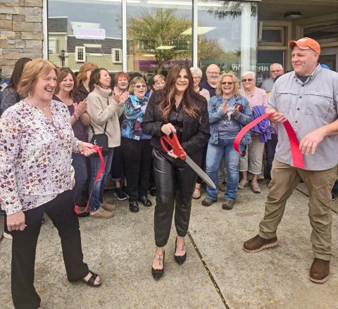 RIBBON’S CUT, NOW ABOUT THAT HAIRDO...