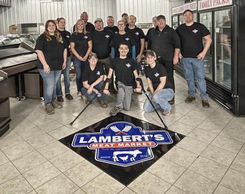 Employees at Lambert’s Meat Market prepare for the soft opening on Wednesday, April 24 and the grand opening at 8 a.m. on Monday April 29.