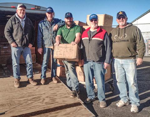 The Gladwin Christian Men’s Club Picking up 2024 boot order at Family Farm &amp; Home.