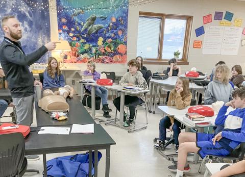 Zach Krahner, a former paramedic and current Community Health Educator for My Michigan Health teaches life saving techniques to Beaverton seventh graders.