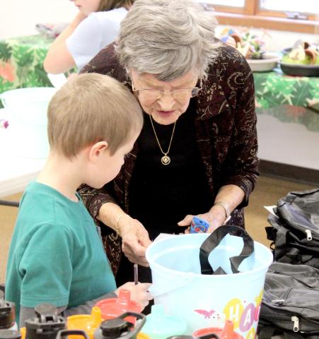 Members of the Christ the King Lutheran Church and the Kidz Club gathered last Tuesday to prepare gift baskets that will be distributed to foster children in Gladwin County.