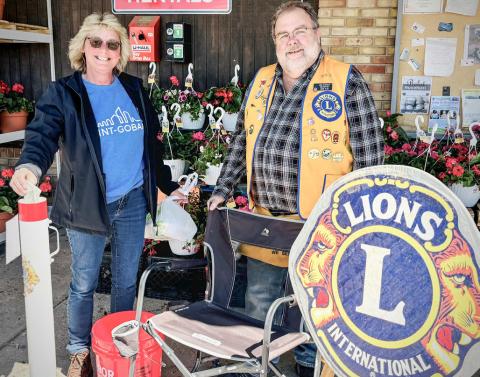 Pictured is Sandy Dollen, with Lions Club member, Mike Stroman, during the White Cane fund drive.
