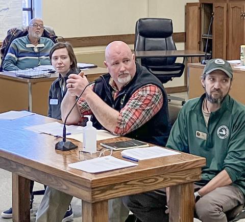 Doug Schultz, at center, of the DNR Fisheries Division is one of several state officials working with Save Trout Lake!