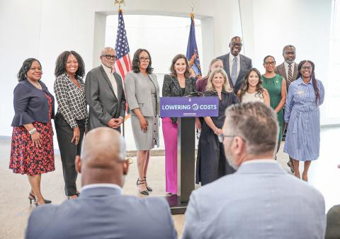 Governor Gretchen Whitmer is pictured announcing recipients of medical debt forgiveness collaborating with Undue Medical Debt.