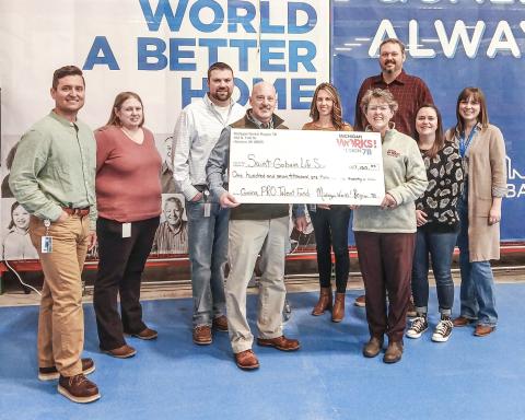 Pictured left to right are Camerin Levi, Jessica Wilder, Ryan Harris, Jon-Paul Jones, Kayla Krahner, Michigan Works! Region 7B Chief Operating Officer Pam O’Laughlin, Ryan Roberts, Jackie Lamont, and Amanda Bootz.