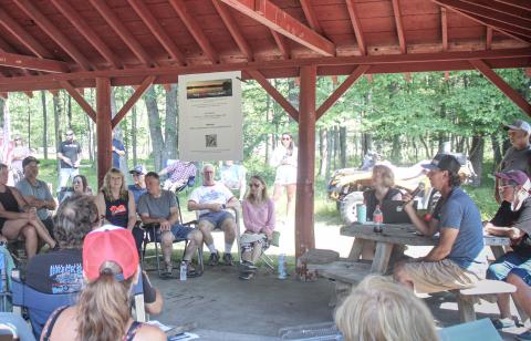 Pratt Lake Association President Jerry Canze addresses a meeting that drew over 50 members of the community to the Sage Township Pavilion Saturday morning to address concerns over the declining level of the lake.
