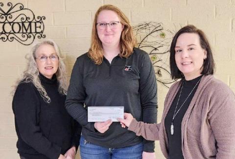 Sarah Hollon (center), Clare County Farm Bureau Young Farmer Co-Chair and golf scramble organizer presented the Gladwin Community Service Corp. – Council on Aging with a $620 donation.