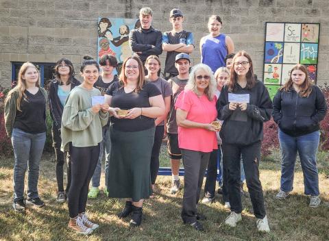 Pictured in front row, left to right: Advanced art students, Aubrey Fairchild and Harmony Albain; and Anna McNeil and Lori Stout from the Council on Aging. Second row, left to right: Aubrey Shanahan, Veronica Gower, Kempton Harvey, Charlotte Mawhorter, Isaac Friesen, Faith Hude, Wyatt Lier, and Brianna Vincent, Back row, left to right: Mason Heppner, Keegan Estes, and Emily Hough.