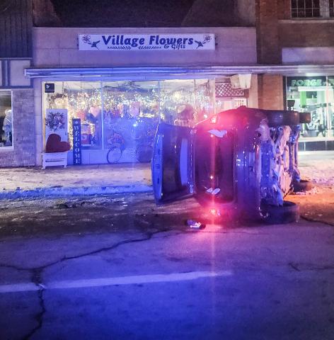 A Jeep Grand Cherokee flipped on its side after striking a parked car on Cedar Ave. last Tuesday night, shutting down traffic downtown for nearly two hours.