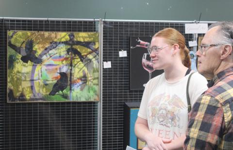 Lynn Morgan and his granddaughter Kailah check out the goods at the Art Show &amp; Sale Saturday morning at the GAFT Theater.