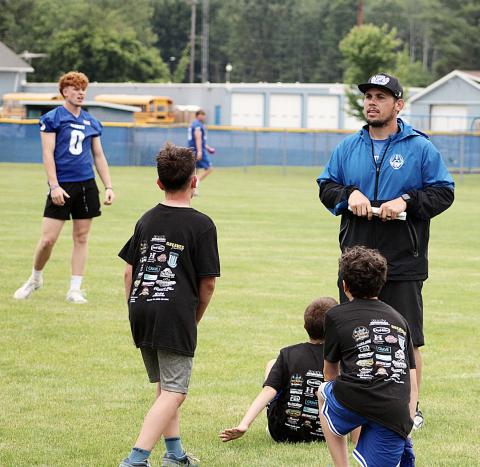 Gladwin coach Kody Emeott gives out directions last Wednesday at the Tim Foor Youth Character and FUNdamentals football camp.