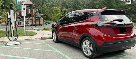 Electric vehicle charging at a park. MICHIGAN DEPARTMENT OF ENVIRONMENT, GREAT LAKES AND ENERGY