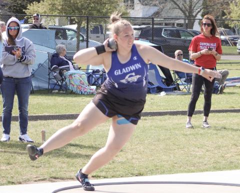 Gladwin’s Makenzie Price puts the shot a school record distance of 42’10.25” to win the gold medal at Cadillac’s Division 2 regional Friday.