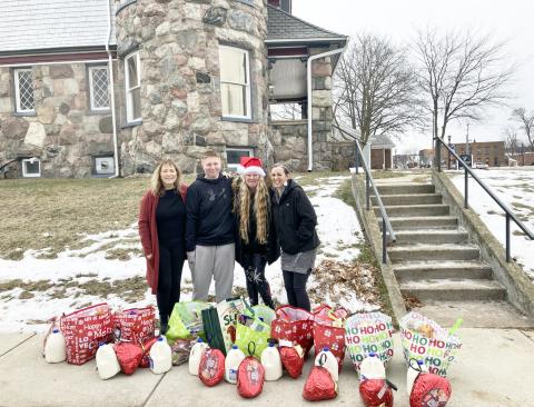Helping pass out the food curbside were Owner Sheryl Sacry, Team Member Kooper Brewer, Kortni; and Chef Monica Antes.