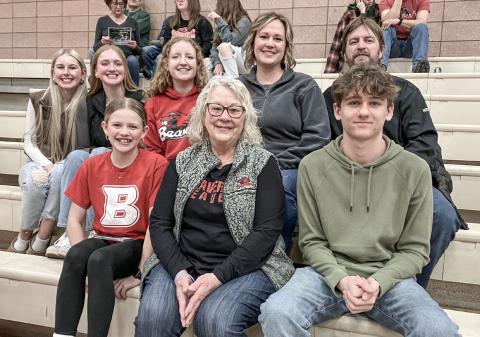 Viola Rusconi (back row, center), a participant in the Rotary Youth Exchange Program from Lecco, Italy, watches Monday night’s Beaverton basketball game with her hosts, the Stoike family. BEAVERTON