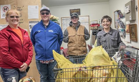 BOY SCOUTS DONATE FOOD TO SACRED HEART MISSION