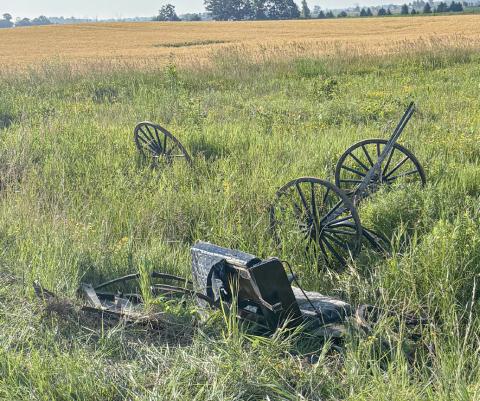 The broken remains of an Amish buggy are strewn on the side of a road after a crash with a vehicle on Wirtz Road on Friday.